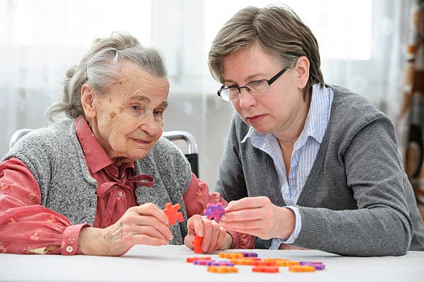 caregiver with elderly woman